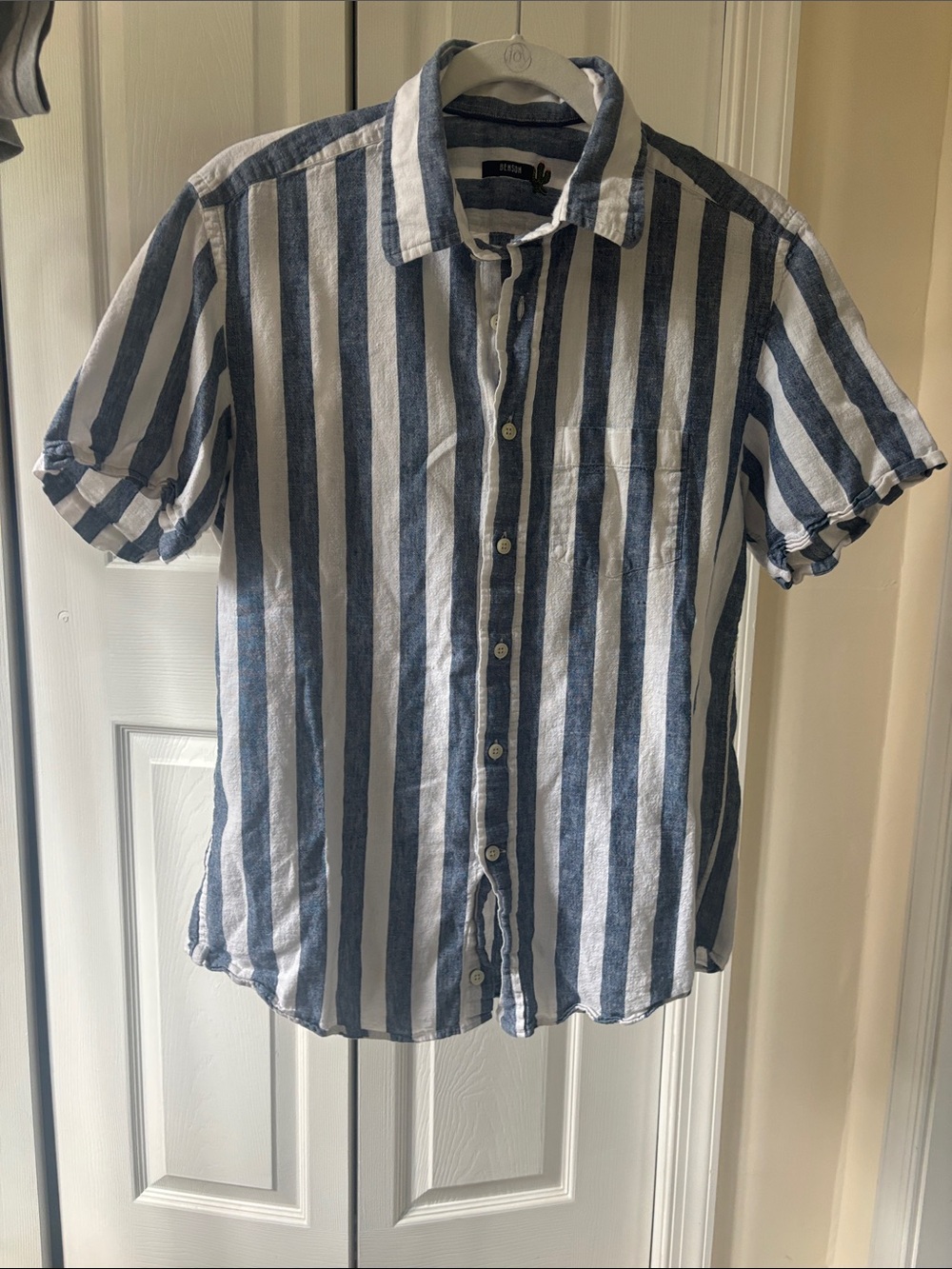 Striped White and Blue shirt. Medium but wears more like a small